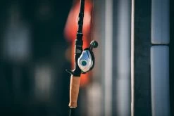 Quantum Energy S3 Baitcasting Reel -Unique Fishing Store energy bc reel and rod side lifestyle